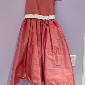 Salmon color little girls dress. Adjustable cream colored wrap around bow!
